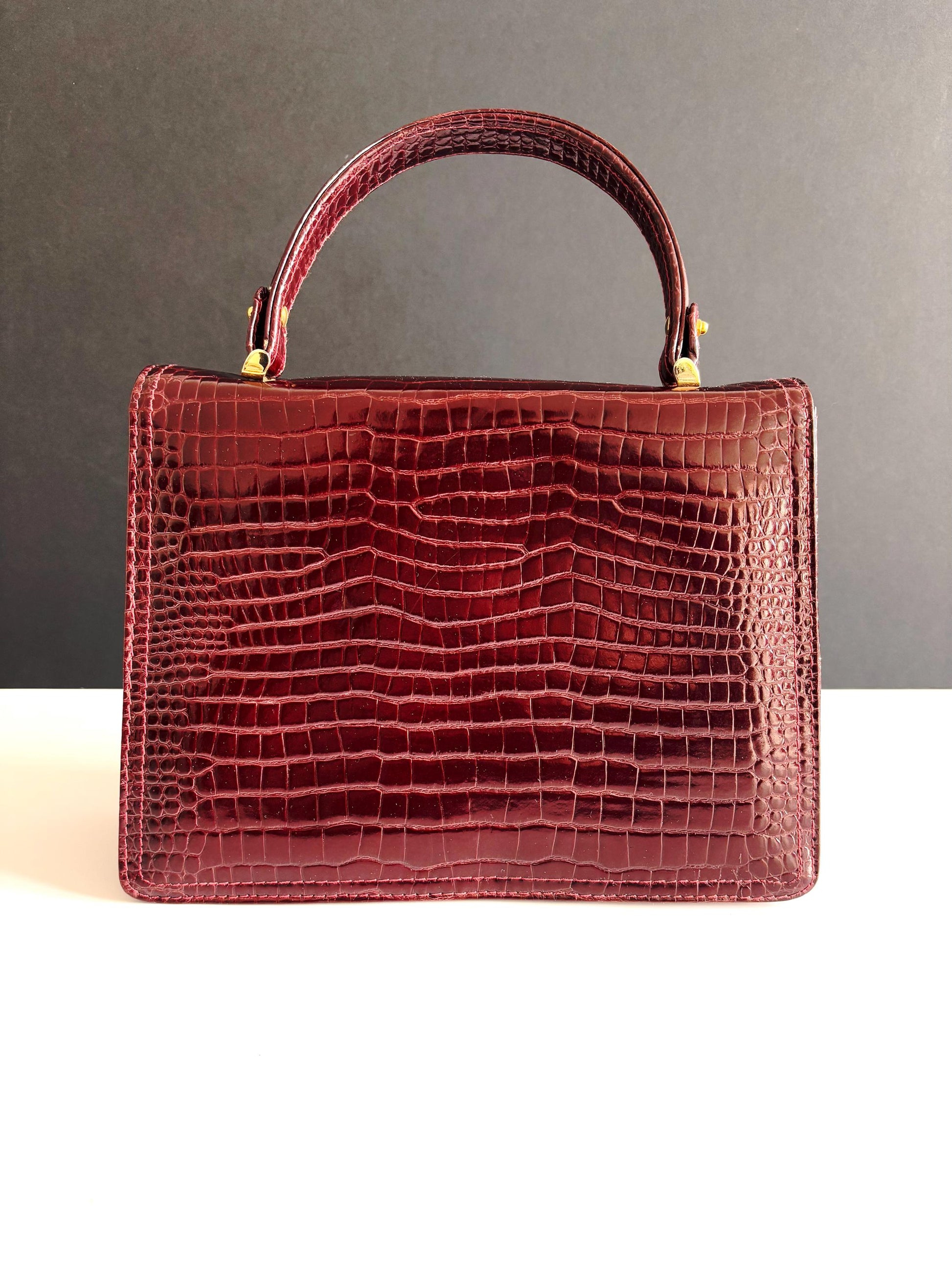 Vintage burgundy patent leather top handle bag , very good condition, late 70's